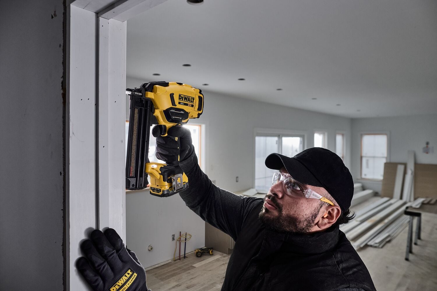 User nailing trim around doorway