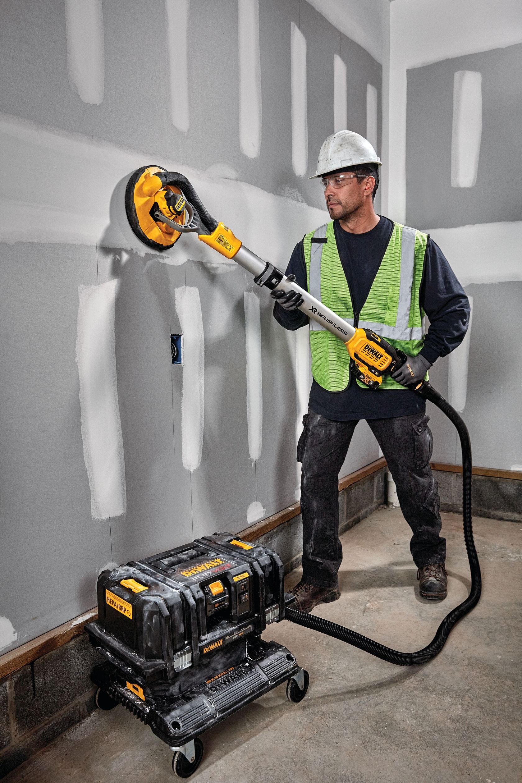 Cordless Dust Extractor being used by a workman.